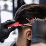 Men's haircut in a barbershop. Styling and hair care.