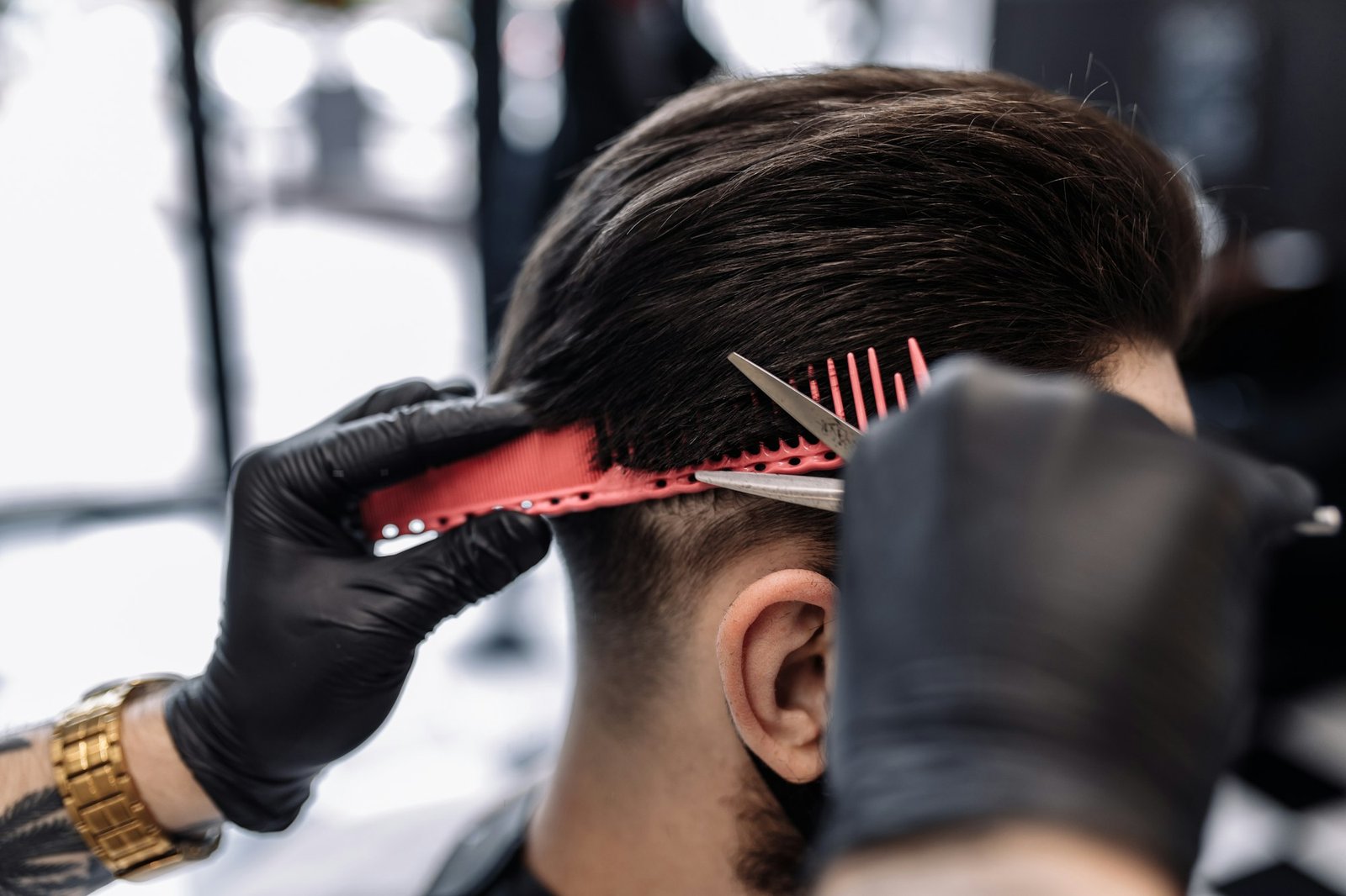 Men's haircut in a barbershop. Styling and hair care.