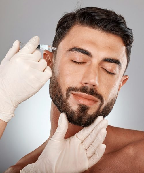 Botox, beauty and injection of man and plastic surgery hands in studio medical aesthetic, face chan