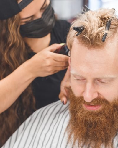 Men's haircut in a barbershop. Hair care